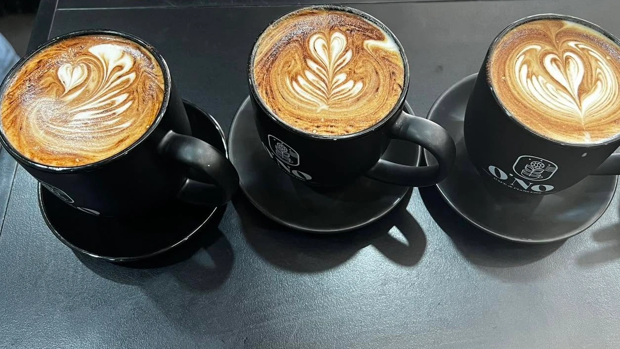 Three coffees with latte art at O’NO